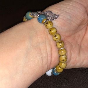 Beaded bracelet with silver leaf accent